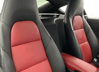 Porsche 718 Cayman — black and red sport seats