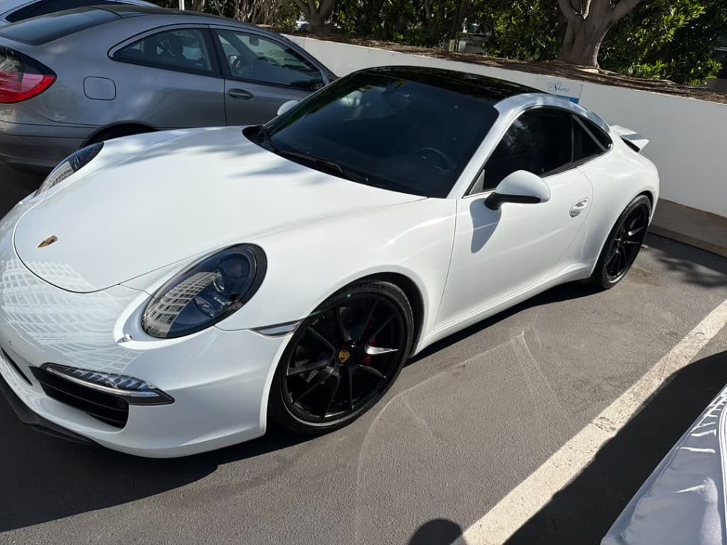 Porsche 911 Carrera S Coupe — front three-quarter with black roof