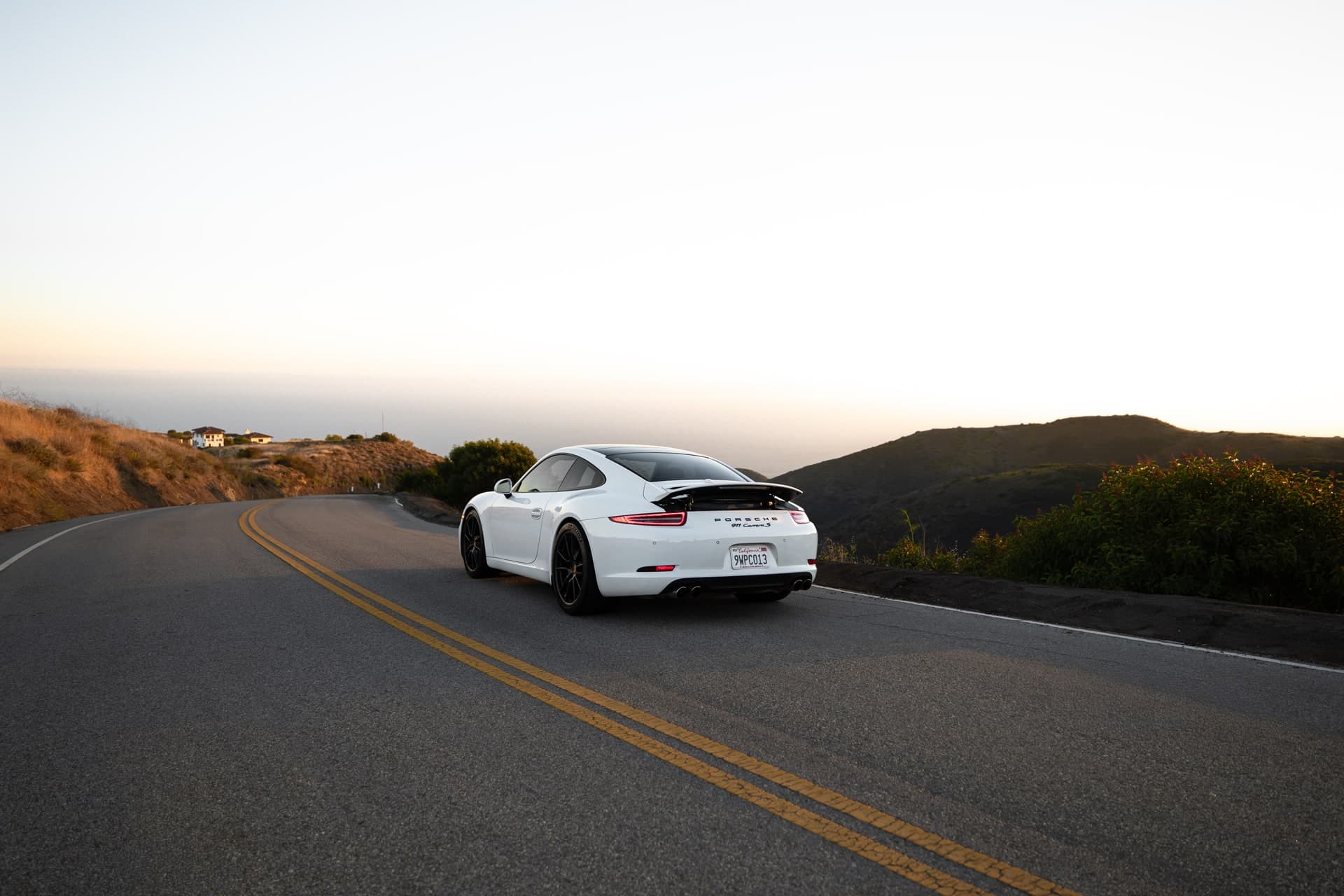 2015 Porsche 911 Carrera S Coupe — rear three-quarter on Pacific Coast Highway