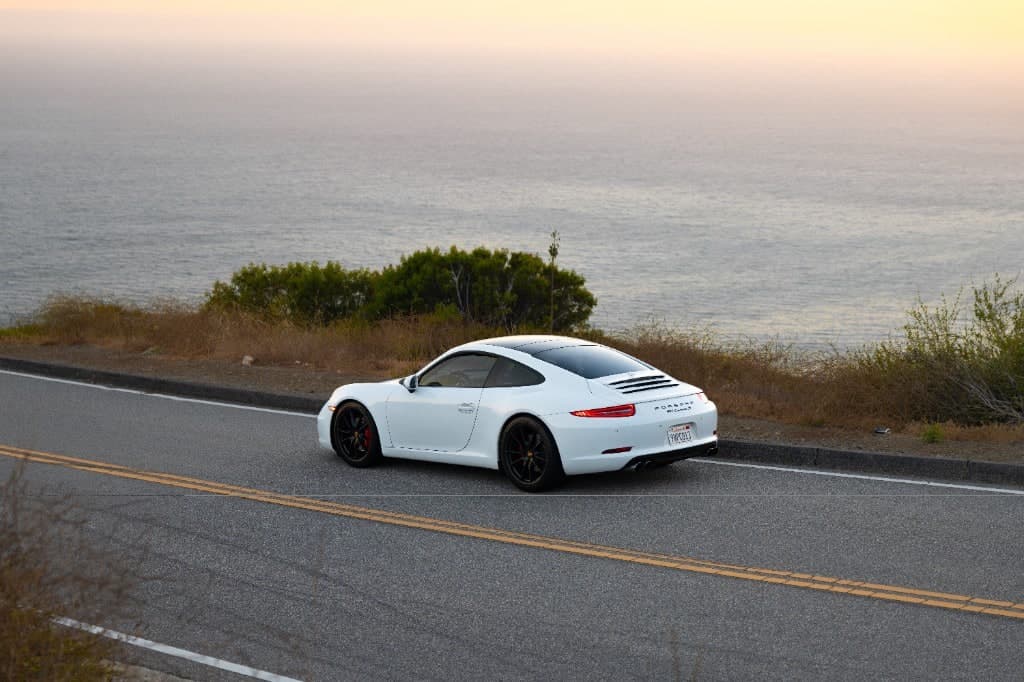 2015 Porsche 911 Carrera S Coupe — coastal rear with red brake calipers