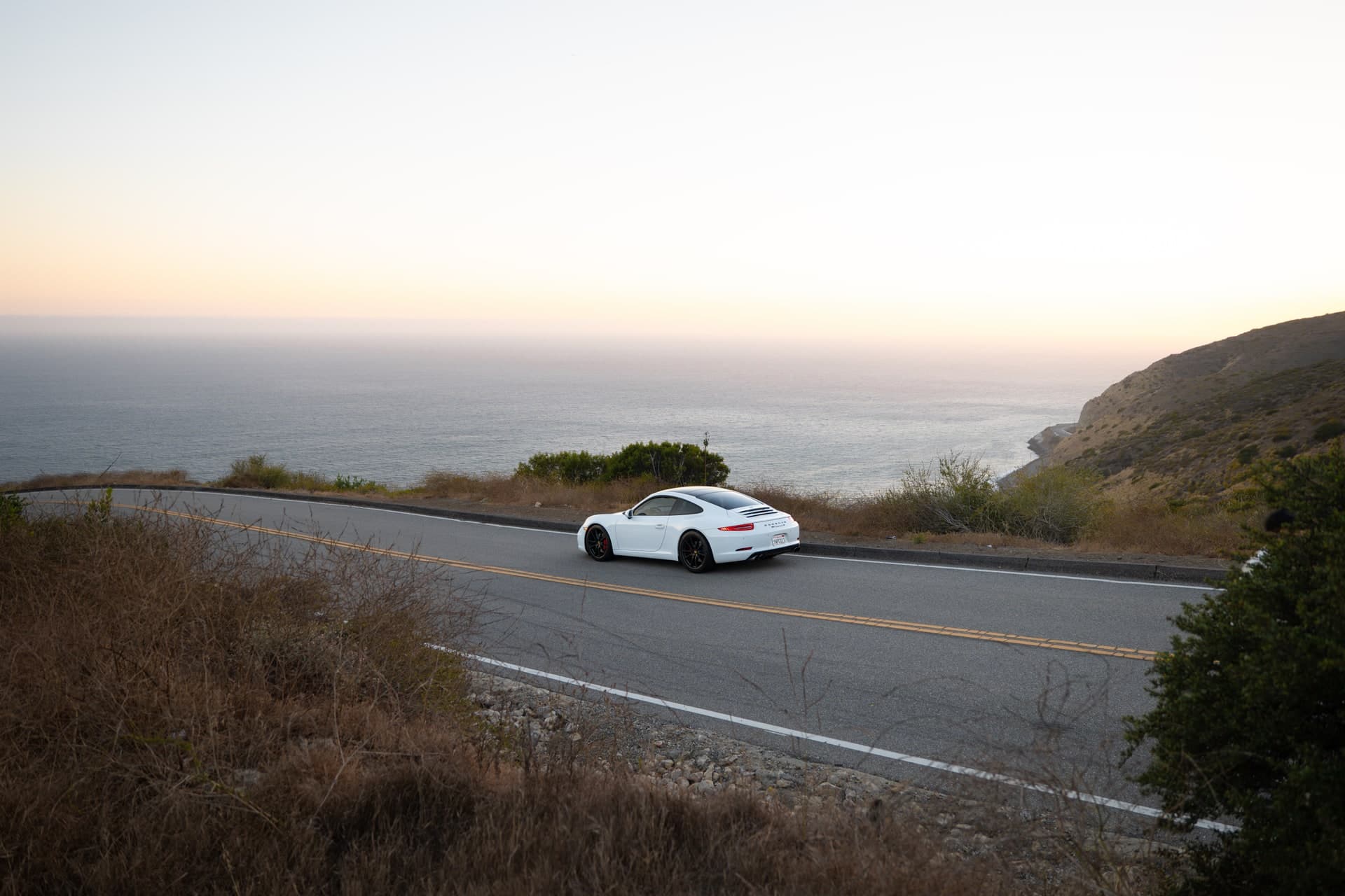 2015 Porsche 911 Carrera S Coupe — scenic coastal rear view