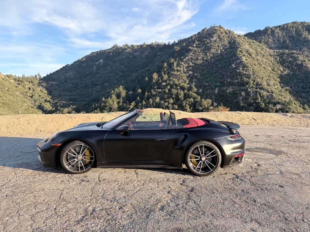 Porsche 911 Turbo S Cabriolet — side profile in the mountains