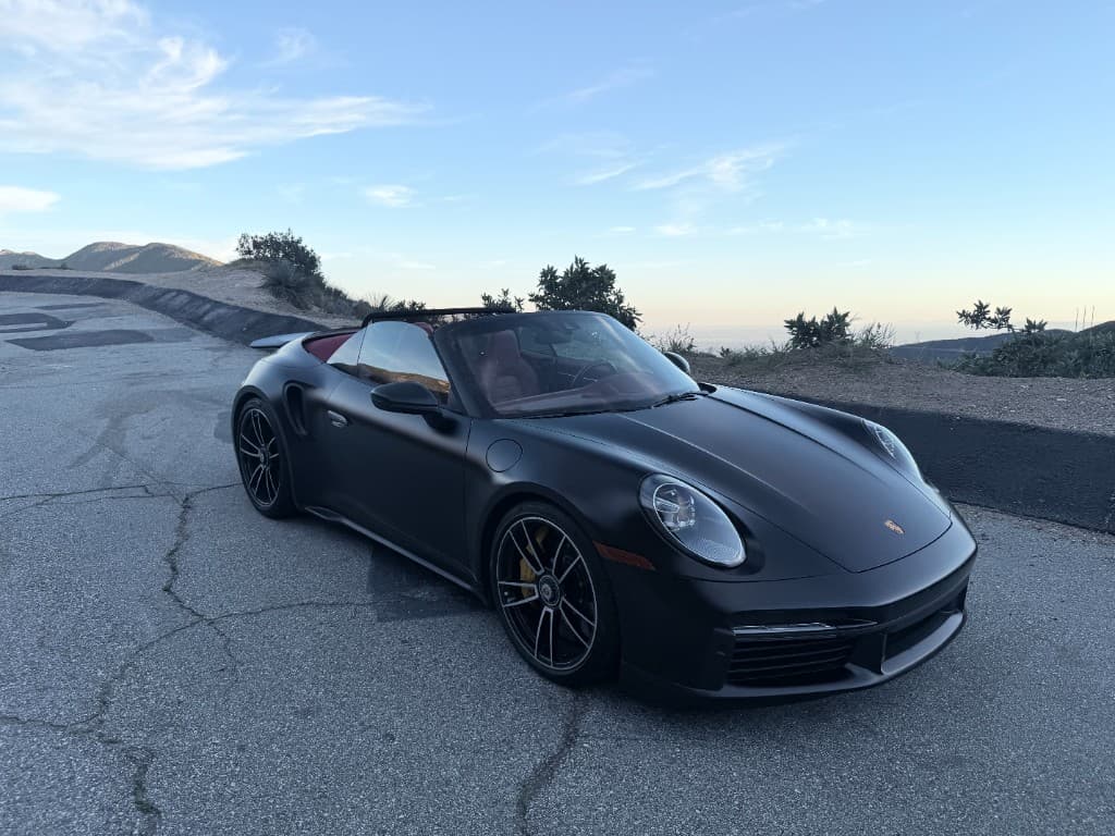 Porsche 911 Turbo S Cabriolet — front angle with red interior