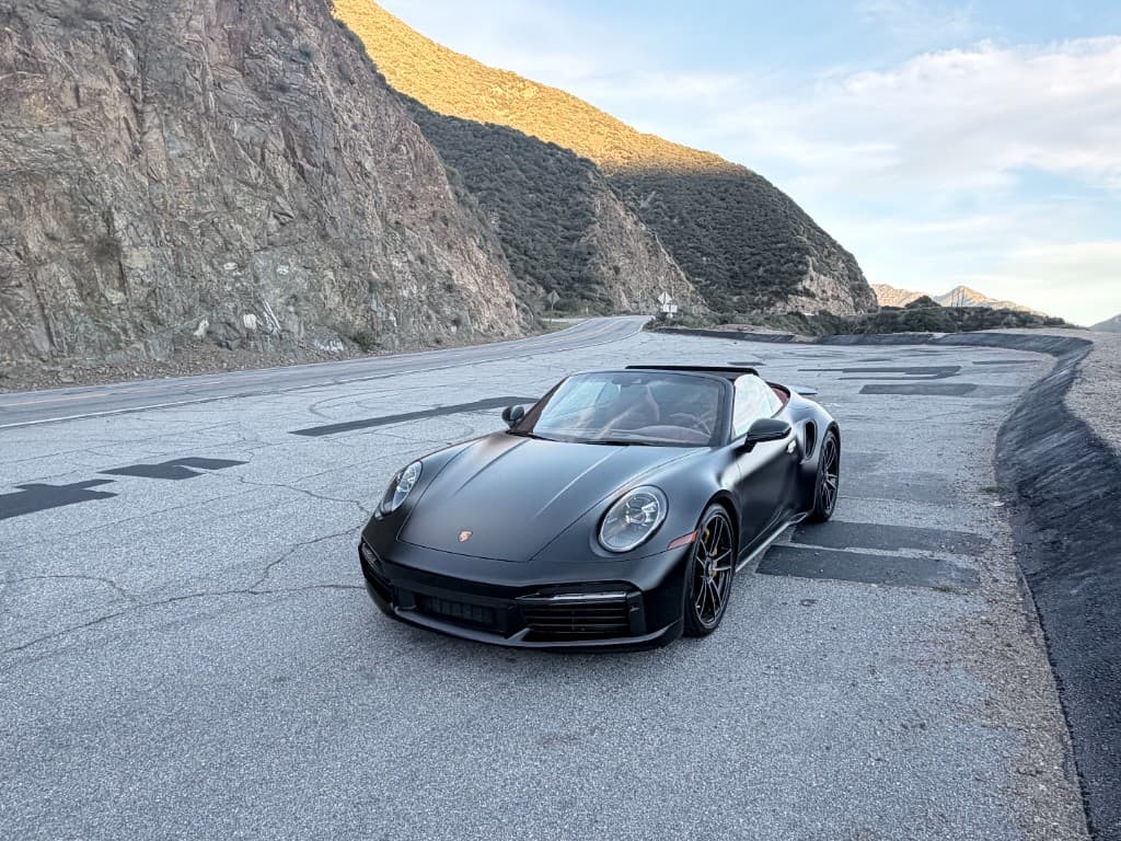 Porsche 911 Turbo S Cabriolet — front three-quarter with canyon backdrop