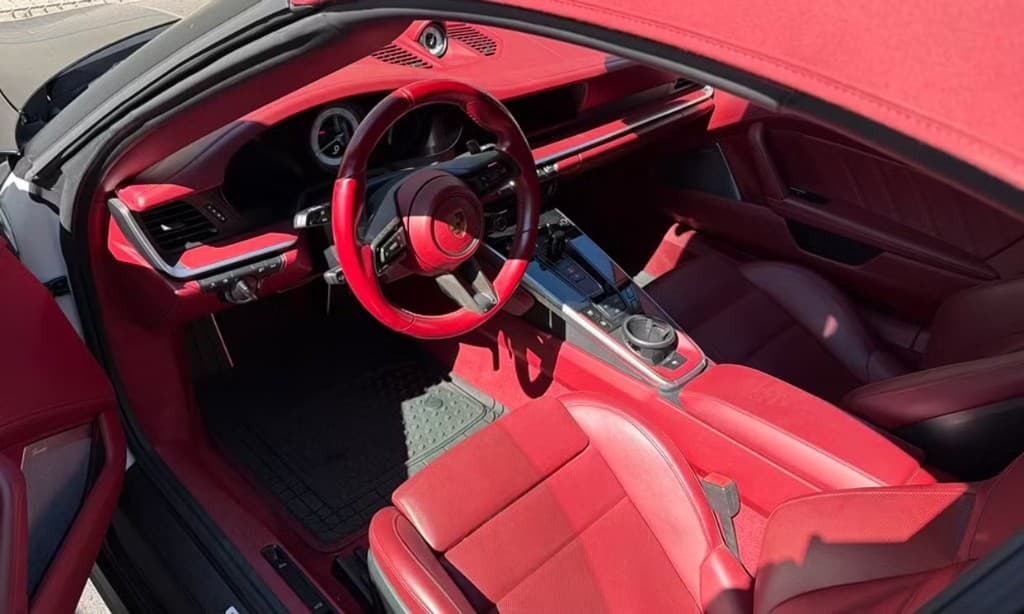 Porsche 911 Turbo S Cabriolet — Bordeaux Red leather interior, driver-side view