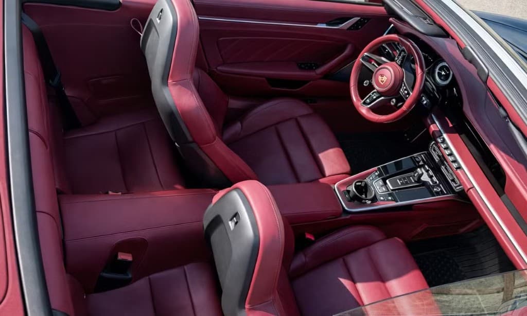 Porsche 911 Turbo S Cabriolet — cabin overview with red leather and Sport Chrono