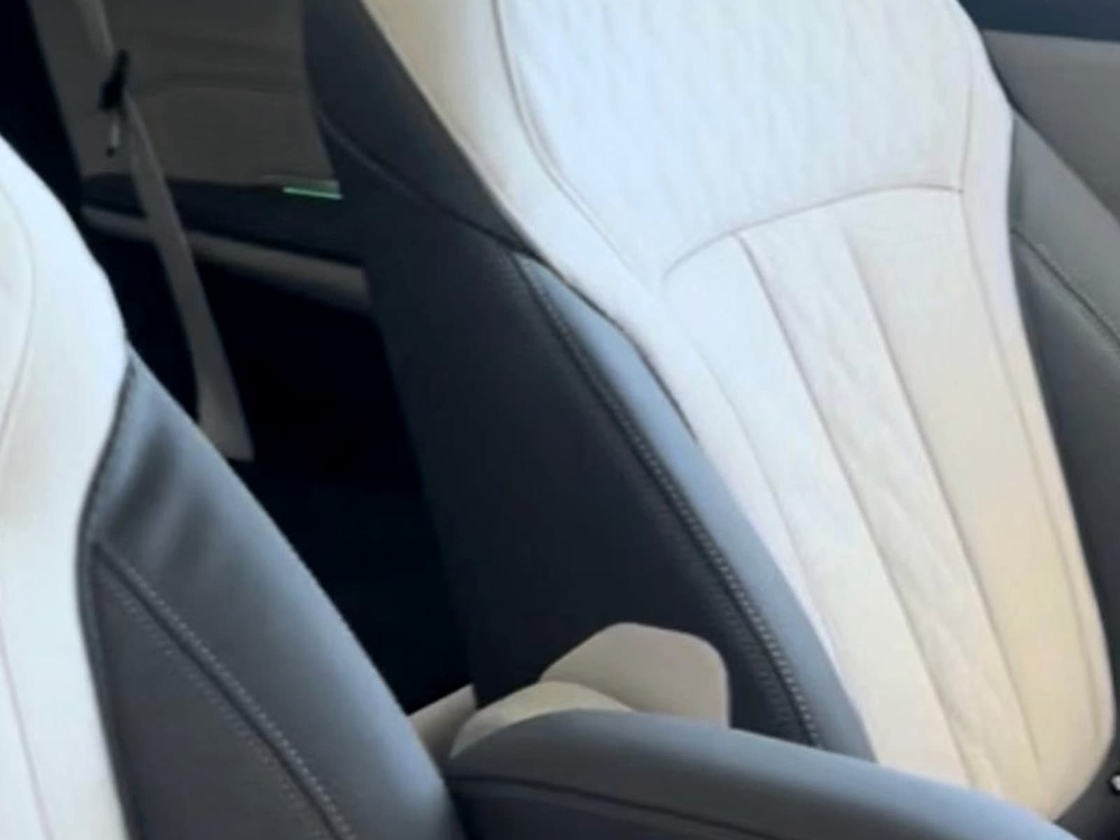 BMW X7 — quilted cream and black leather captain's chairs